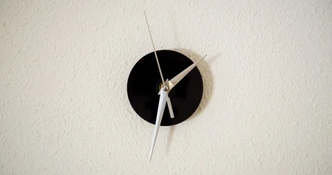 Timelapse of clock on white backgroungd and movement of clock hands. Stock Footage 122628574