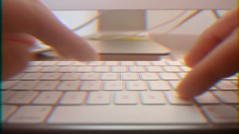 Timelapse of close up of hands typing in a computer keyboard with prism effect Stock Footage 103506981