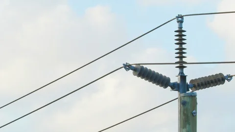 Timelapse Close up of high voltage power line pole in suburban area. Clouds Stock Footage 130107093