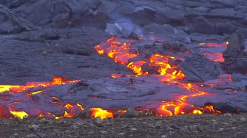 Timelapse Close Up Magma Flow Lava Burns Smokes Rocky Ground in Iceland Stock Footage 256710855