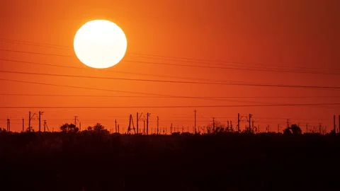 Timelapse. Close-up of the sun on the background of a railway track with a Video stock 239167365