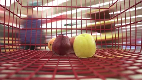 Timelapse close up view the buyer puts fresh chopped fruits in the red shopping Stock-Footage 246589333
