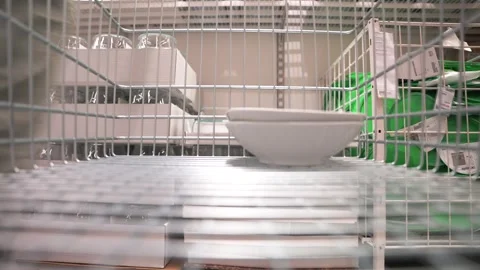 Timelapse close up view the buyer puts the dishes in the stainless steel Stock Footage 246631917