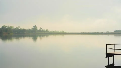 Timelapse cloud and sky  with mountain and haze on lake on foreground Stock Footage 296215011