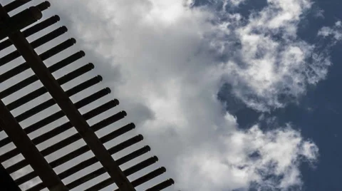 TimeLapse Cloud Fence Stock Footage 32359799