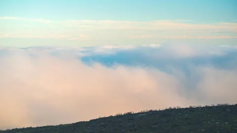 Timelapse of cloud layer drifting above mountain ridge at sunset, Tenerife, Cana Stock Footage 335018265