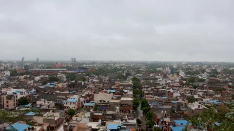 Timelapse of Cloud Movement Over Evening Cityscape with Dense Urban View Stock Footage 287278065