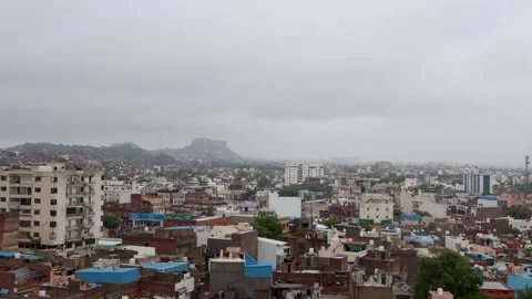 Timelapse of Cloud Movement Over Evening Cityscape with Dense Urban View Stock Footage 287692114