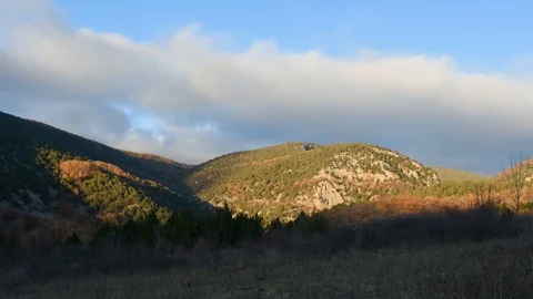 Timelapse of cloud movement at sunset in the mountains Stock Footage 124641500
