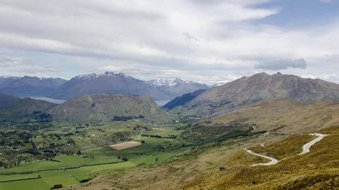 Timelapse cloud moving at Mt Remarkables range with light diffuse through Stock Footage 104750736
