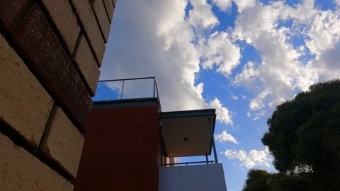 Timelapse cloud moving over building MOV Stock Footage 227423150