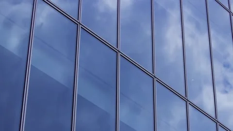 A timelapse of cloud reflecting the office building sunny day Stock Footage 346637214