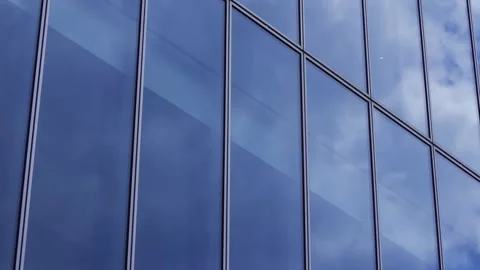 A timelapse of cloud reflecting the office building sunny day Stock Footage 346637215