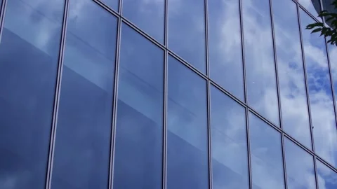 A timelapse of cloud reflecting the office building sunny day Stock Footage 346637220