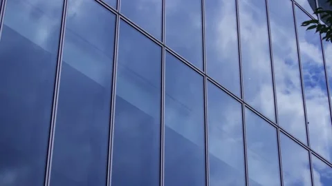 A timelapse of cloud reflecting the office building sunny day Stock Footage 346637237