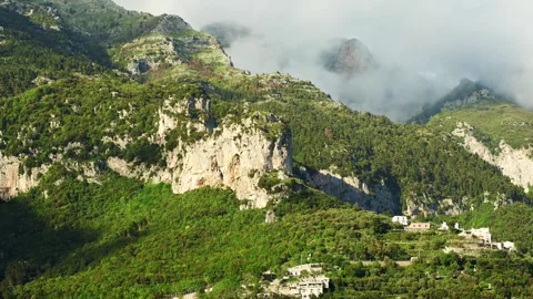 Timelapse of clouds along the mountain above Positano, Italy. Stock Footage 241527681