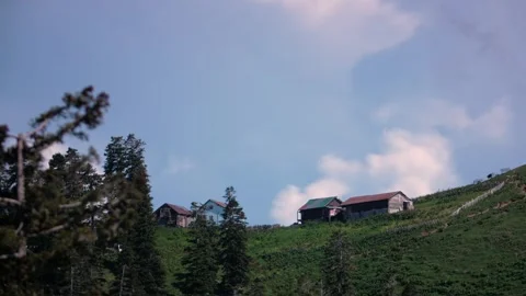 Timelapse of clouds in an alpine village Stock Footage 297963263