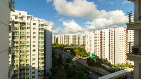 Timelapse of clouds and blue sky over apartment building in Punggol in Singapore Stock Footage 124477888
