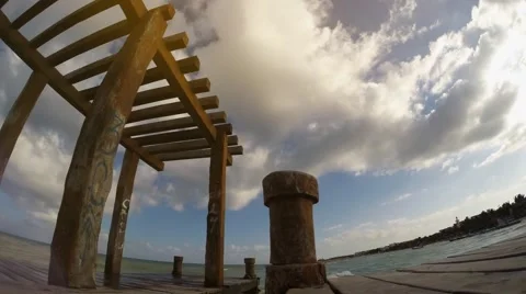 Timelapse of clouds and a dock on the ocean Stock Footage 44267313