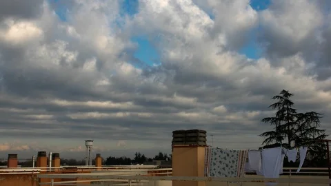 Timelapse clouds and hanging clothes Stock Footage
