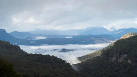 Timelapse of clouds and mist moving in a valley in the Blue Mountains Stock Footage 114581779