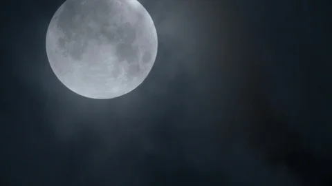 Timelapse of clouds and Moon moving through the sky Video stock 89574999