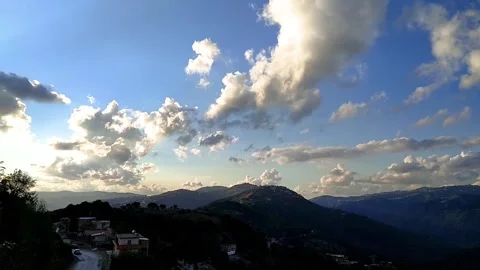 Timelapse of clouds and Mountains in afternoon Stock Footage 266396568