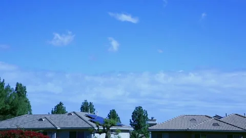 TIMELAPSE - CLOUDS AND ROOFTOPS Stock Footage 332623796