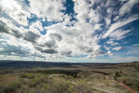 Timelapse of clouds and shadows speeding over Montana Stock Footage 61940343