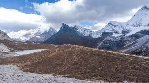 Timelapse of clouds and snow mountain at Yading national reserve, Yunnan, China Stock Footage 124906440