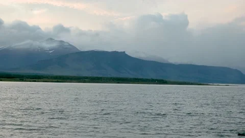 Timelapse of clouds and storm over high mountain landscape with lake waters Stock Footage 226556819