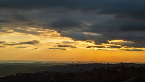 Timelapse of Clouds and Sun in Yellow skyscape above Central Valley Stock Footage 278776252