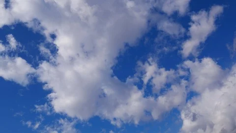 Timelapse - Clouds appearing one after another in the blue sky Stock Footage 88926495