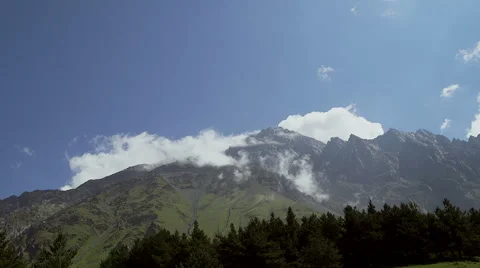 Timelapse. Clouds are running through the mountains. Stock Footage 66063094