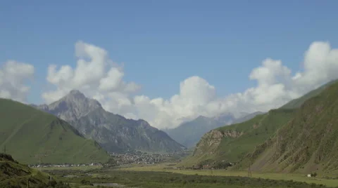 Timelapse. Clouds are running through the mountains. Stock Footage 66063179