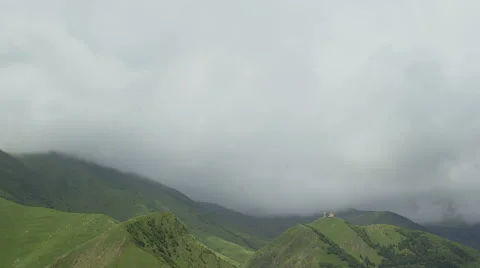 Timelapse. Clouds are running through the mountains. Stock Footage 66063211