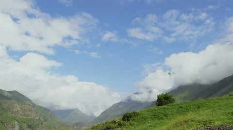 Timelapse. Clouds are running through the mountains. Stock Footage 66063216