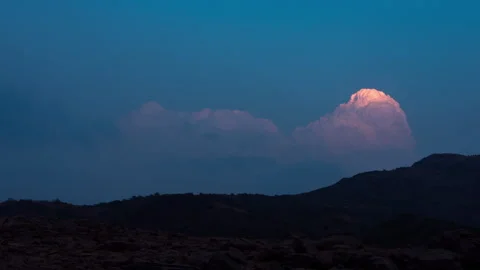 Timelapse - Clouds behind a mountain 4K30 Stock Footage 271195194