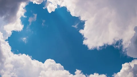 Timelapse of Clouds, Blue Sky, and Sun Rays Stock Footage 111103994