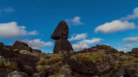 Timelapse of clouds in blue sky moving over the rock formation Stock Footage 73011220