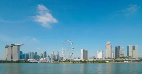 Timelapse of clouds on blue sky over panorama of Singapore Stock Photos