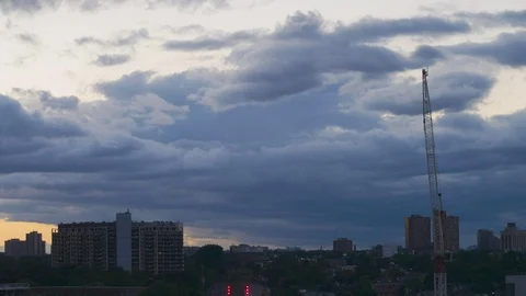 Timelapse of clouds with buildings in the horizon looking west in Toronto Stock Footage 104535741
