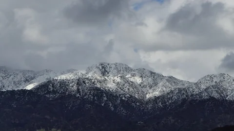 Timelapse Clouds Casting Shadows On Snow Covered Mountain Tops Stock Footage 236648716
