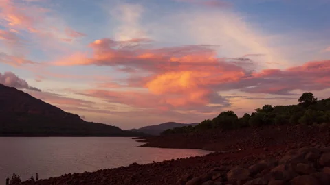 Timelapse - Clouds changing colours during sunset 4K60 Stock Footage 268792960