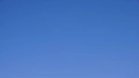 Timelapse of Clouds in a Clear Blue Sky Stock Footage 276730469