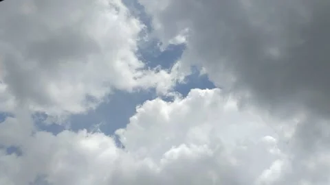 Timelapse of clouds with a clear blue sky during the day. natural background 動画素材 295841260