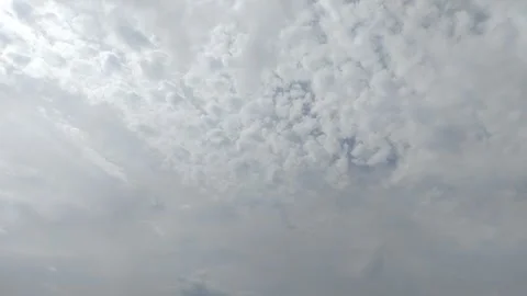 Timelapse of clouds with a clear blue sky during the day. natural background 動画素材 295841320