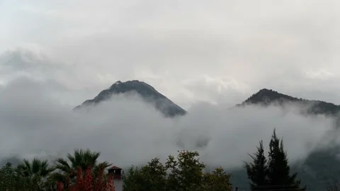 Timelapse of clouds covering beautiful mountains 動画素材 222886466