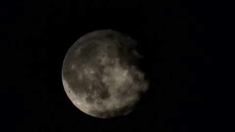 Timelapse of clouds covering the full moon at night Stock Footage 339033887