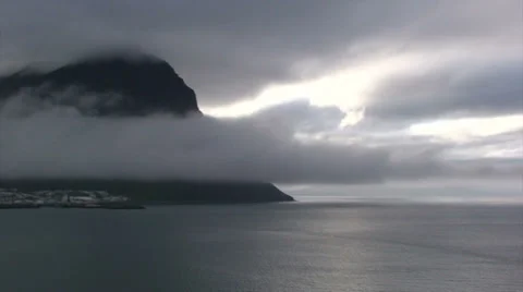 Timelapse of Clouds covering mountain and Bolungarvik town with half fjord Stock Footage 37272365